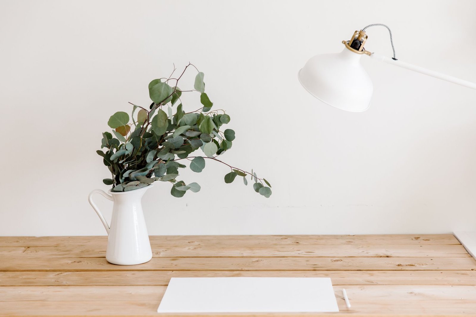 Kado studio desk with sketches, stationery and material samples